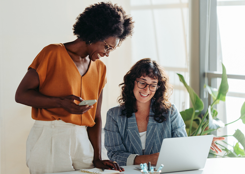Two women working together